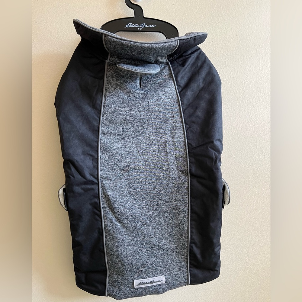 Eddie Bauer Jacket. Tailored techniques; knit fabric insert with cording & flap